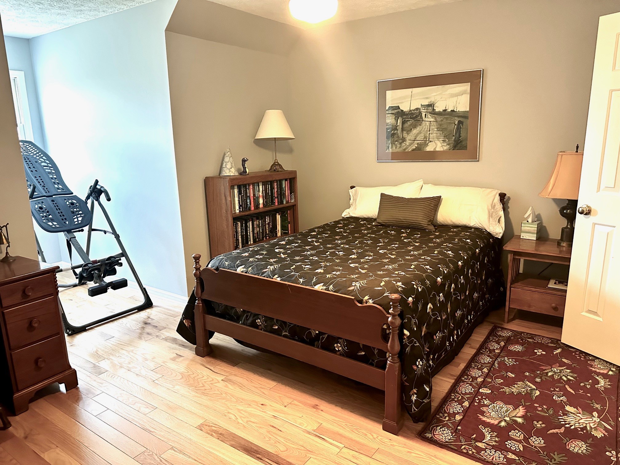 5292 Old Harding Road Franklin, TN 37064 - Photo 21 of 25 a bed sitting in a bedroom next to a window with tv and couch