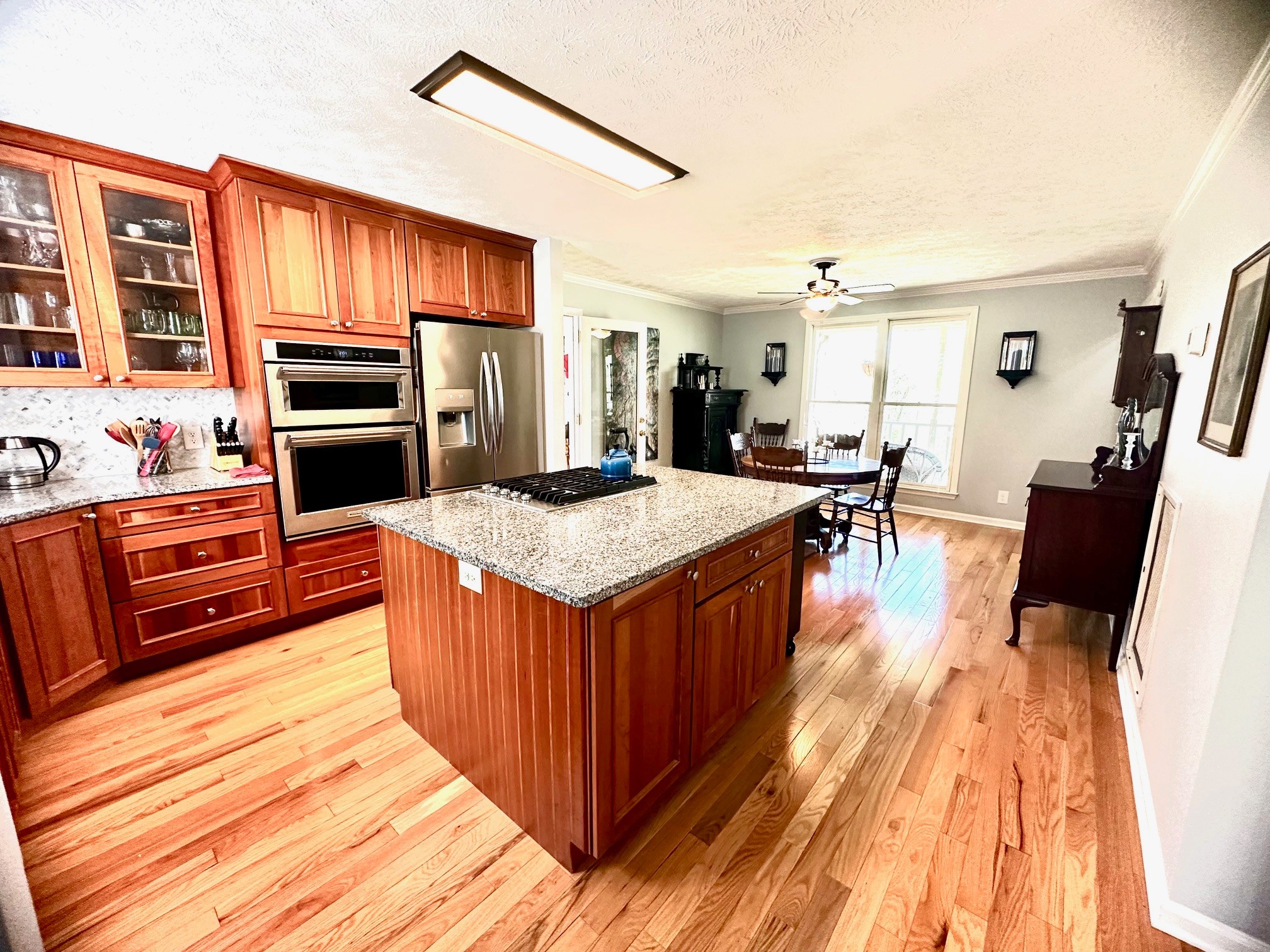 5292 Old Harding Road Franklin, TN 37064 - Photo 10 of 25 a kitchen with stainless steel appliances granite countertop wooden cabinets a stove top oven a sink and dishwasher