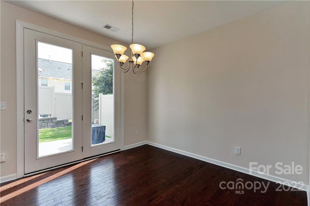1110 Roderick Drive Fort Mill, SC 29708 - Photo 13 of 37 a view of a room with wooden floor and a ceiling fan