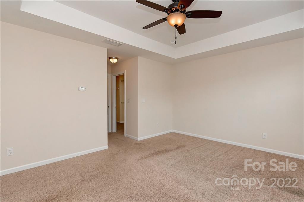 1110 Roderick Drive Fort Mill, SC 29708 - Photo 17 of 37 an empty room with a ceiling fan and carpet