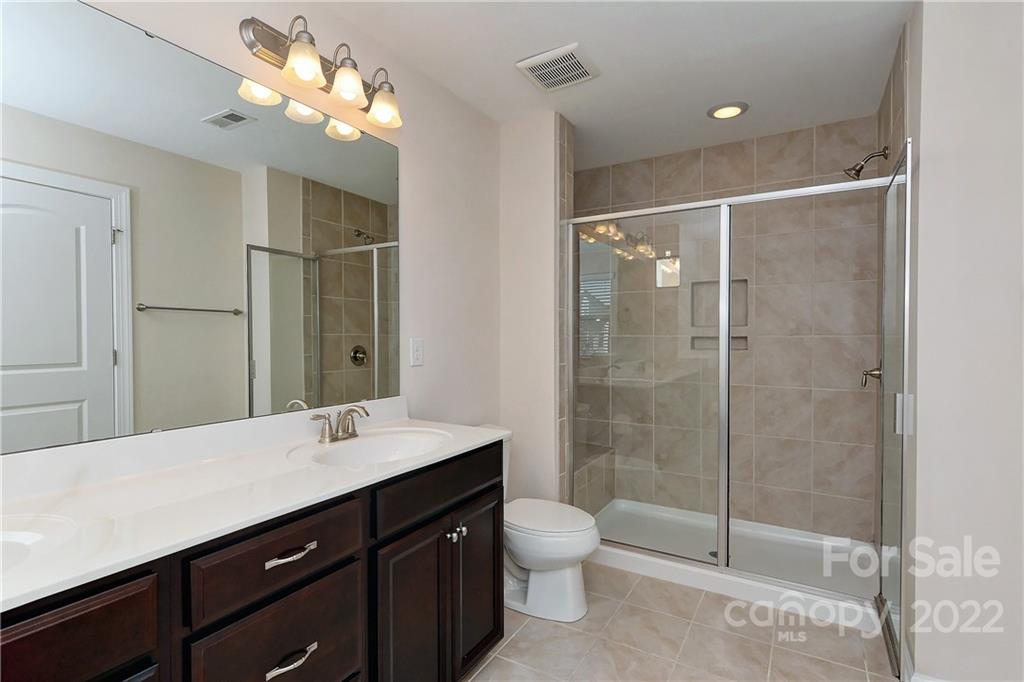1110 Roderick Drive Fort Mill, SC 29708 - Photo 19 of 37 a bathroom with a double vanity sink toilet and shower