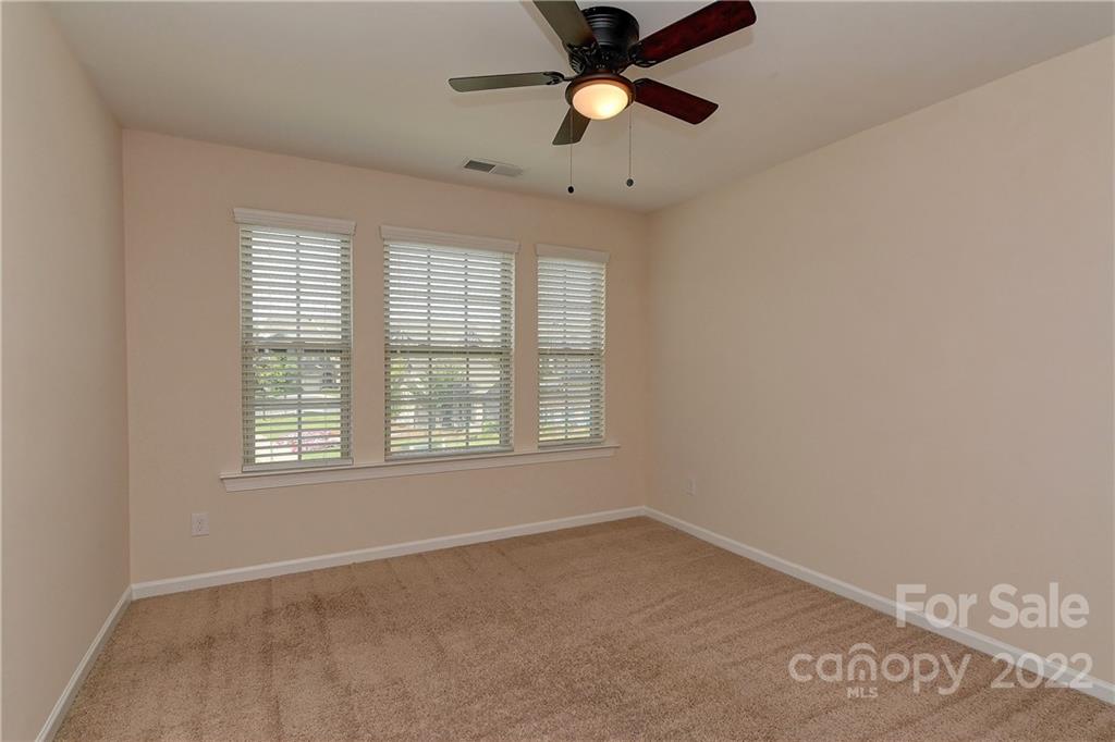 1110 Roderick Drive Fort Mill, SC 29708 - Photo 23 of 37 an empty room with a window and a fan