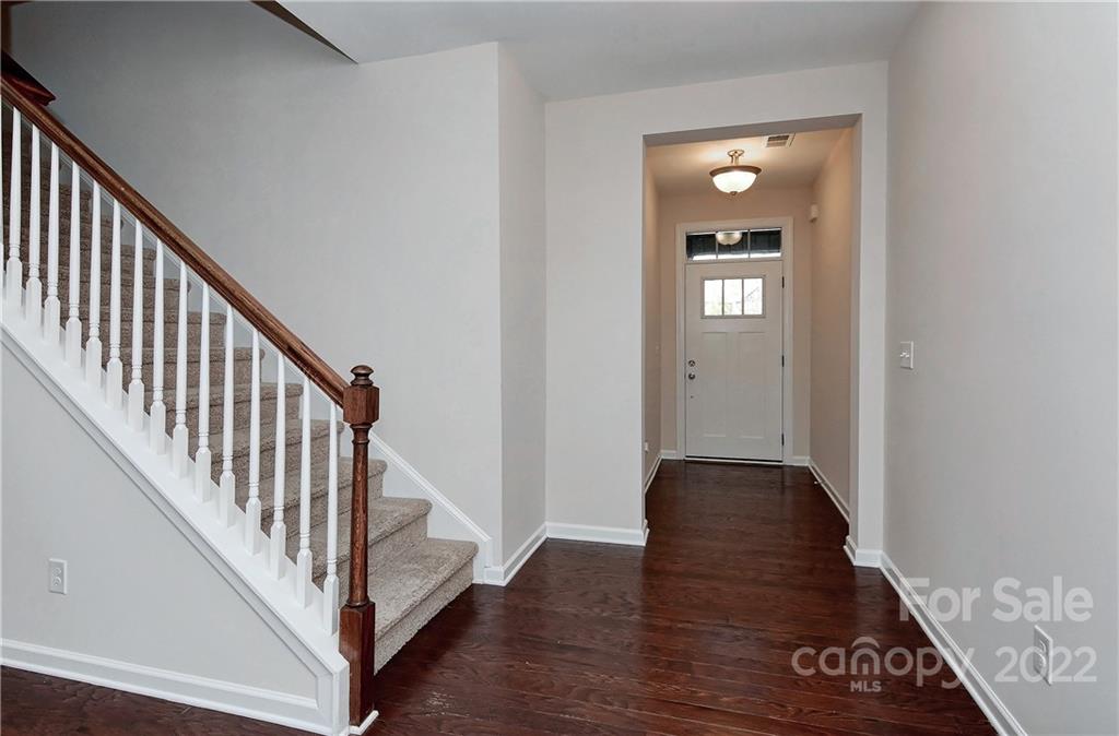 1110 Roderick Drive Fort Mill, SC 29708 - Photo 3 of 37 a view of a hallway with wooden floor and stairs