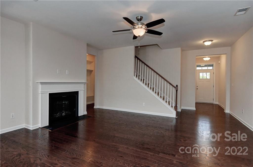 1110 Roderick Drive Fort Mill, SC 29708 - Photo 4 of 37 a view of an empty room with wooden floor and a fireplace