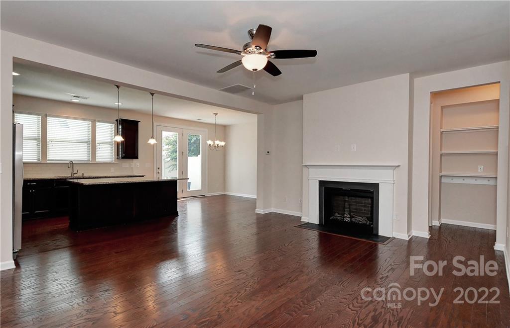 1110 Roderick Drive Fort Mill, SC 29708 - Photo 5 of 37 a living room with a fireplace and wooden floor