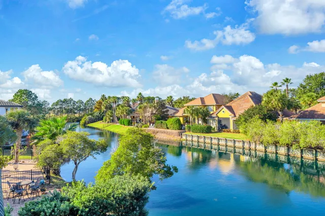 a view of a swimming pool with an outdoor seating