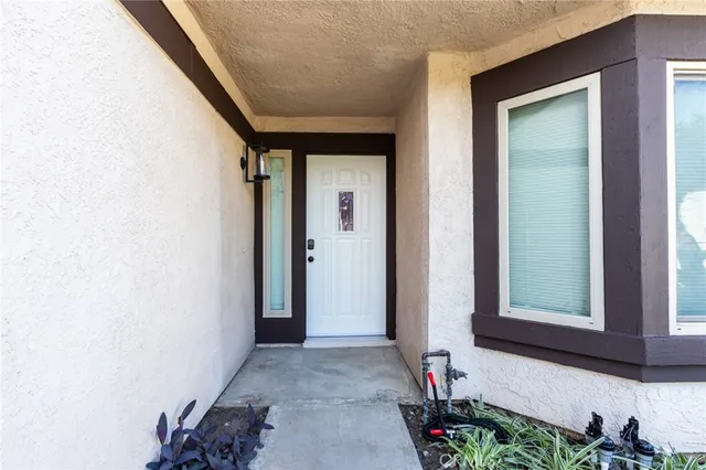 a view of an entryway with wooden floor
