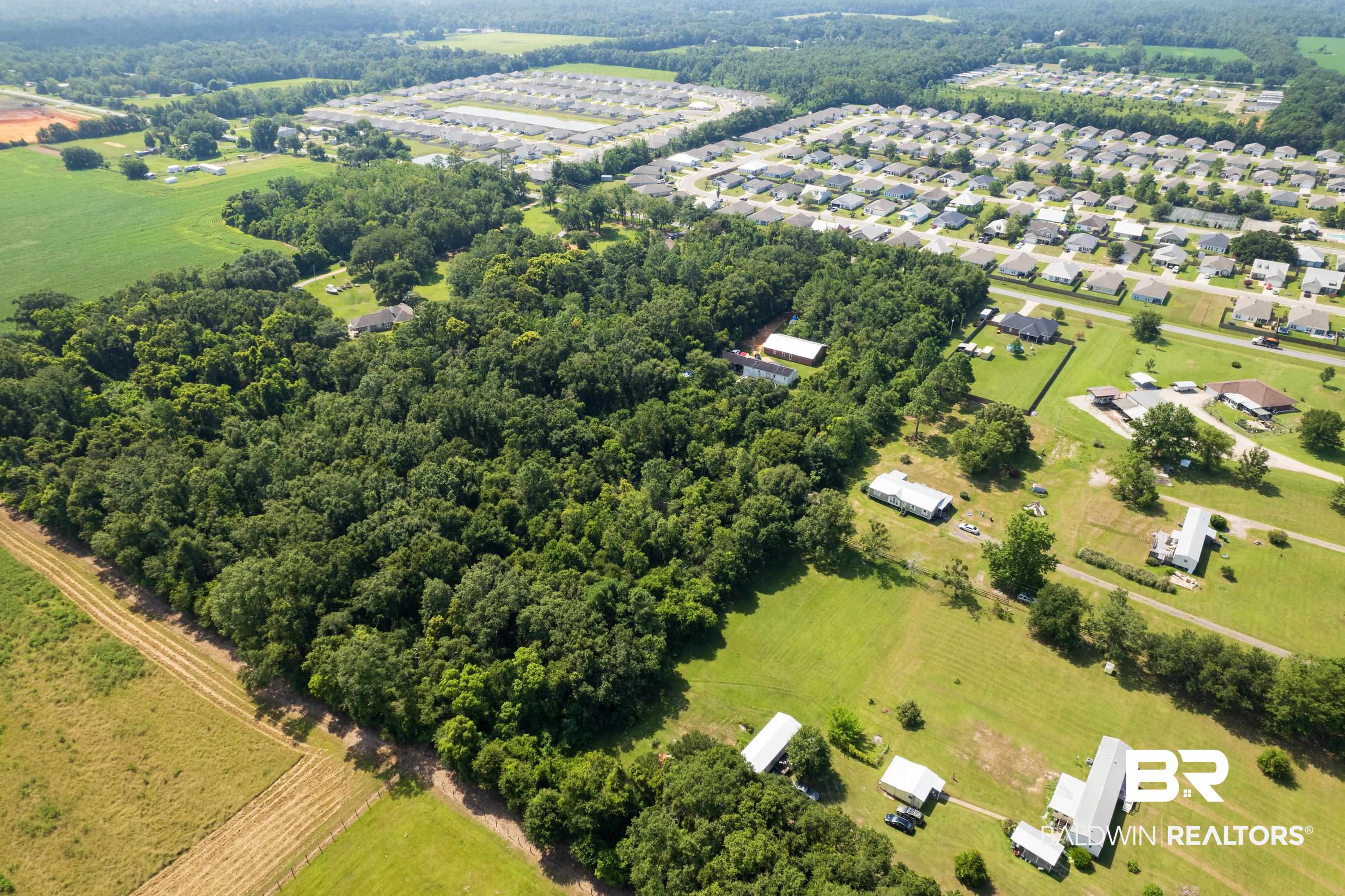 Birds eye view of property featuring a rural view