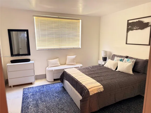 a bed room with a bed and a couch