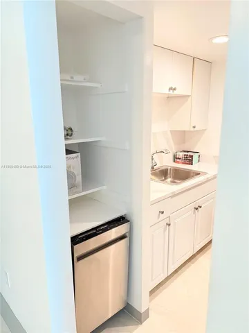 a kitchen with stainless steel appliances a refrigerator and a stove