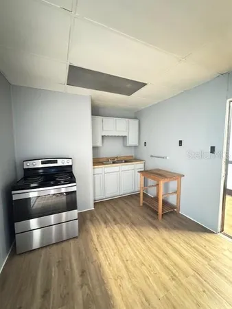 a kitchen with a stove and a microwave