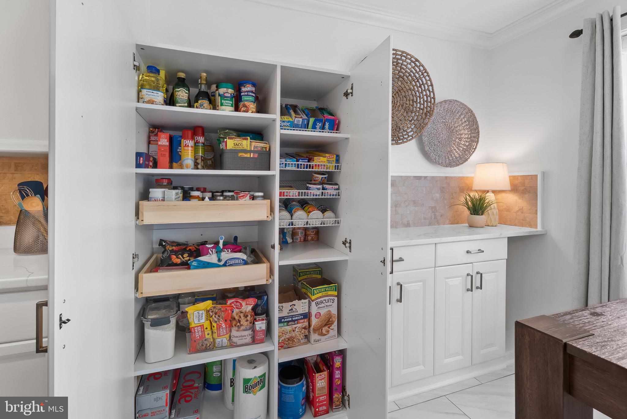 2406 Dominion Drive, Unit 1B Frederick, MD 21702 - Photo 11 of 30 a room with book shelf and a painting on the wall