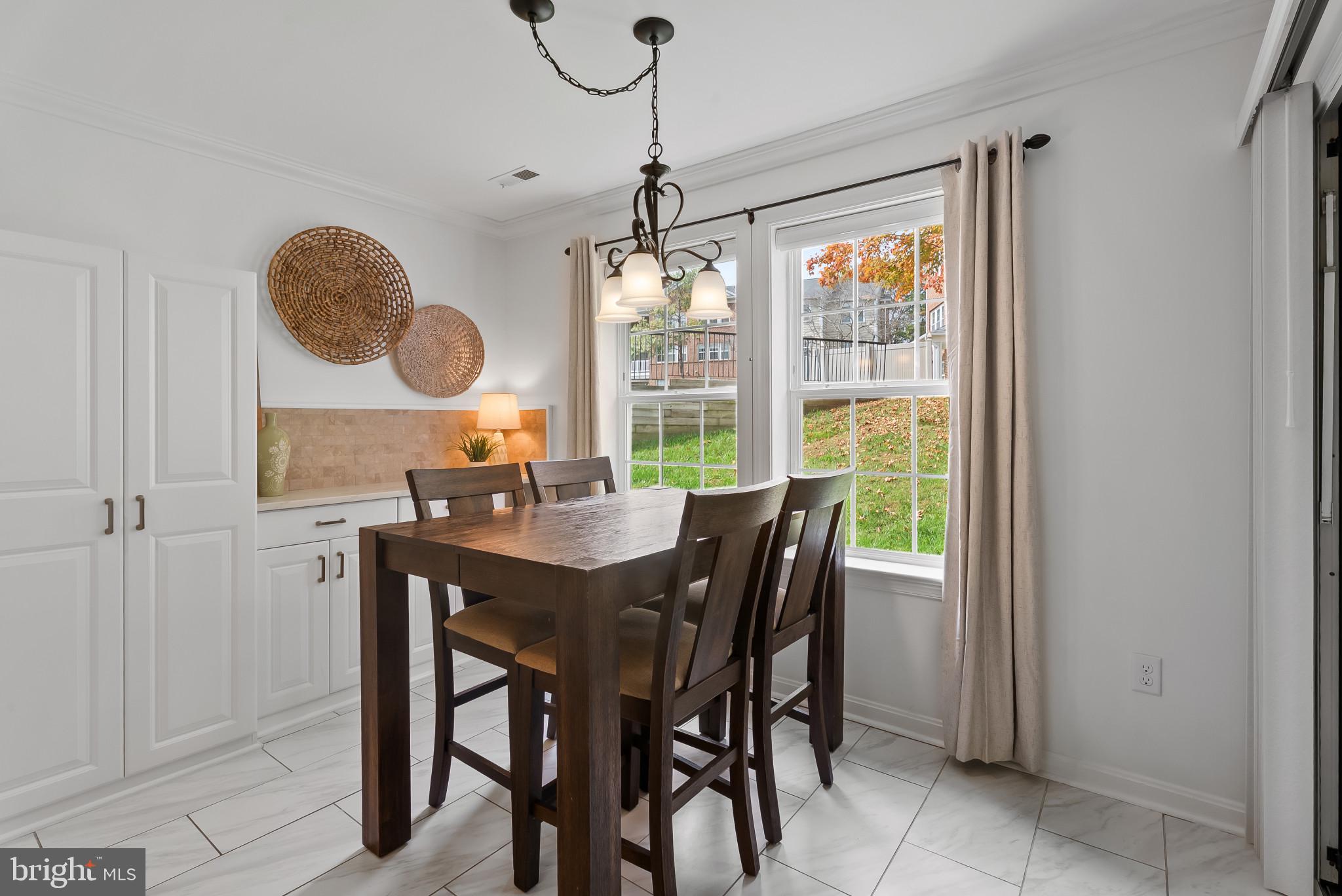 2406 Dominion Drive, Unit 1B Frederick, MD 21702 - Photo 12 of 30 a view of a dining room with furniture window and outside view