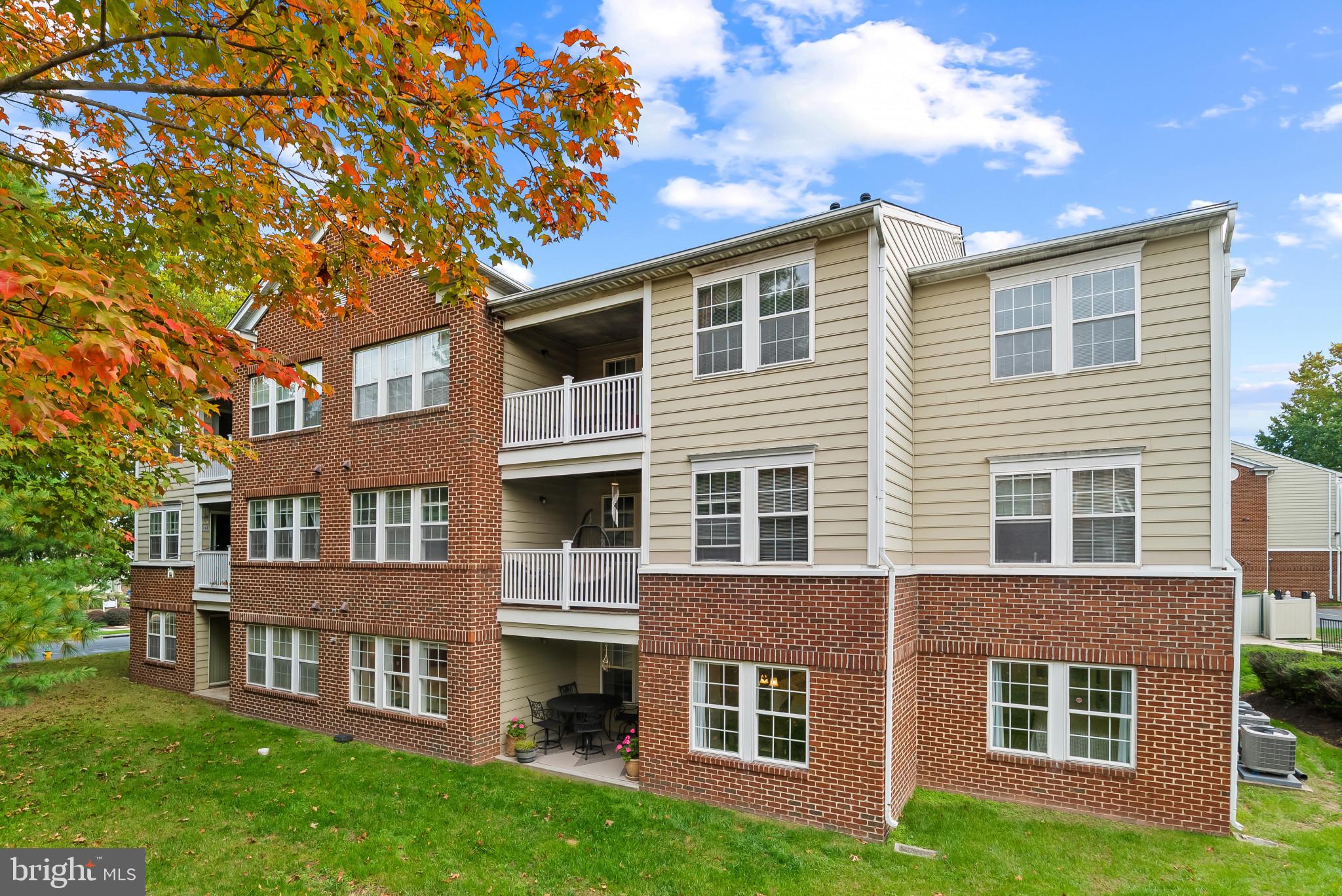 2406 Dominion Drive, Unit 1B Frederick, MD 21702 - Photo 24 of 30 a front view of a house with a garden