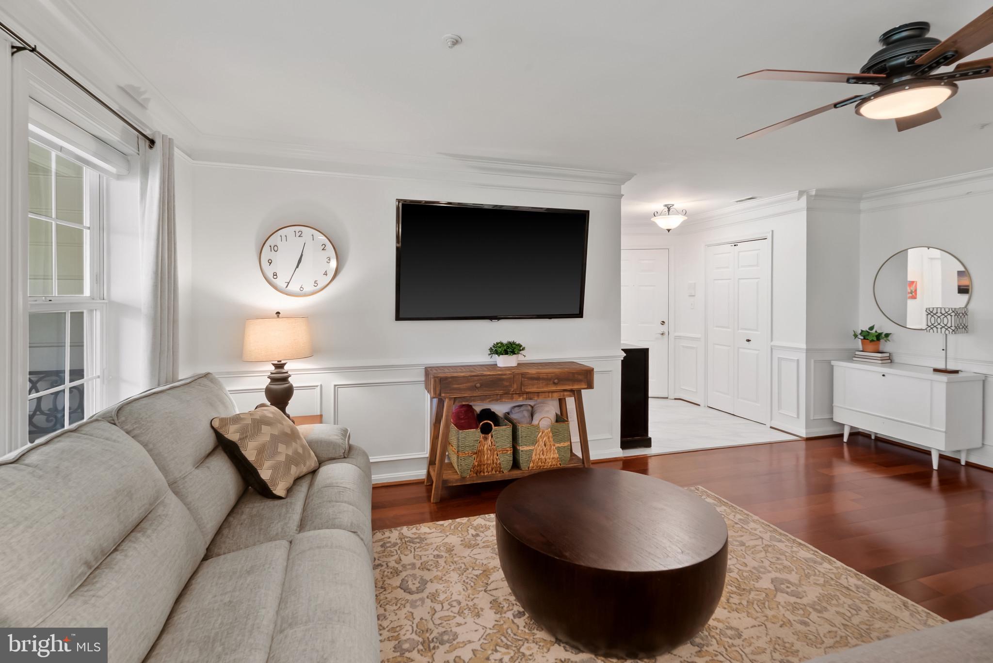 2406 Dominion Drive, Unit 1B Frederick, MD 21702 - Photo 28 of 30 a living room with furniture and a flat screen tv
