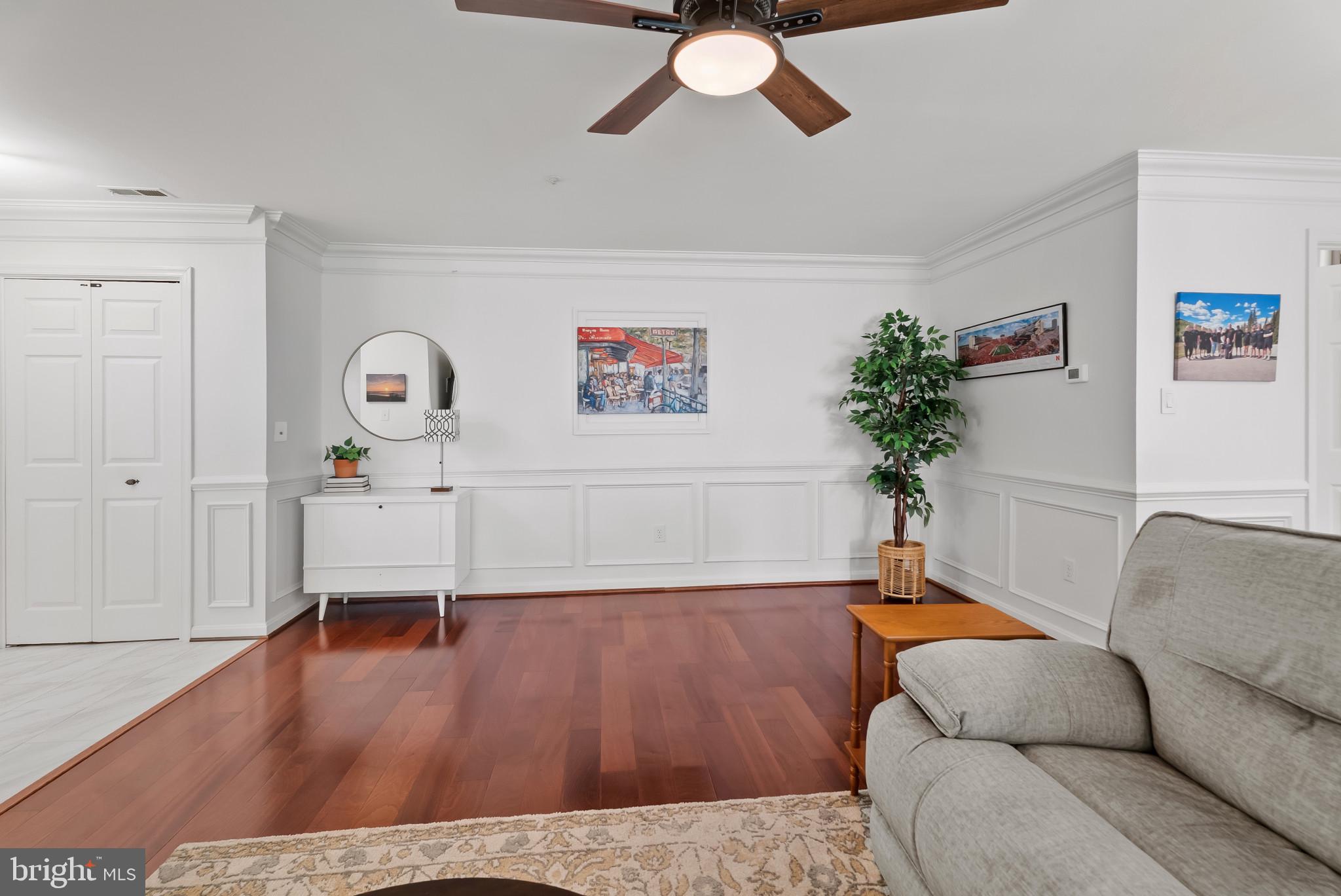 2406 Dominion Drive, Unit 1B Frederick, MD 21702 - Photo 29 of 30 a living room with furniture and a potted plant