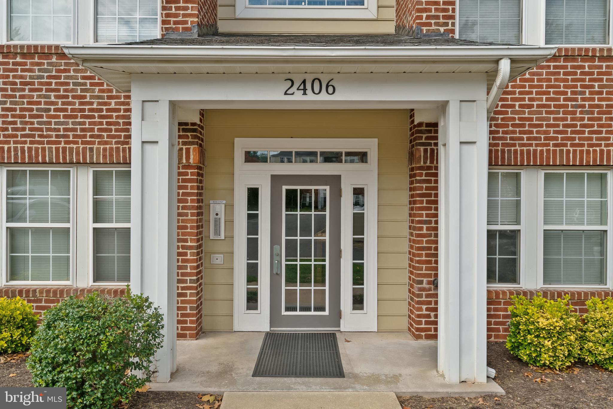 2406 Dominion Drive, Unit 1B Frederick, MD 21702 - Photo 3 of 30 a front view of a building with entryway