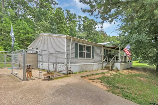 a house with trees in the background