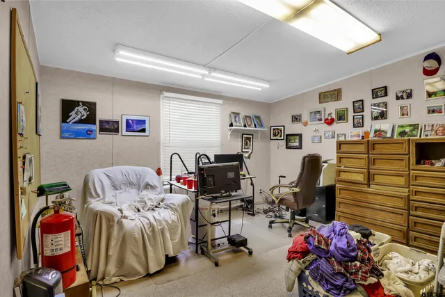 a bedroom with furniture and a bed