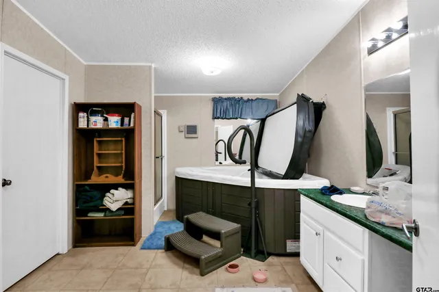 a bathroom with a sink double vanity and a mirror