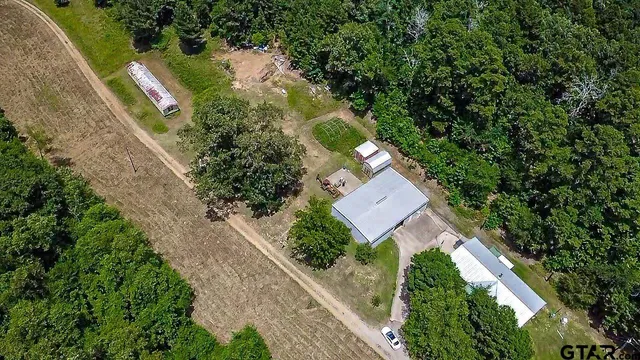 an aerial view of house with yard