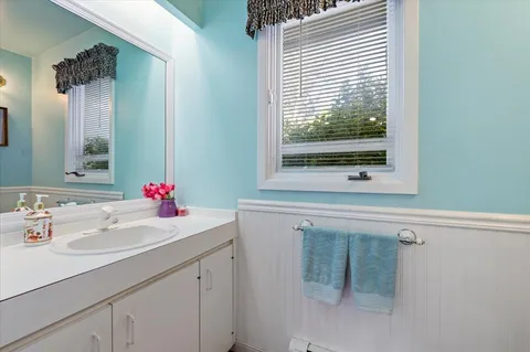 a bathroom with a sink and a mirror