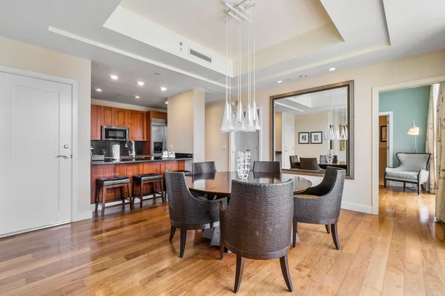 a view of a dining room with furniture window and wooden floor