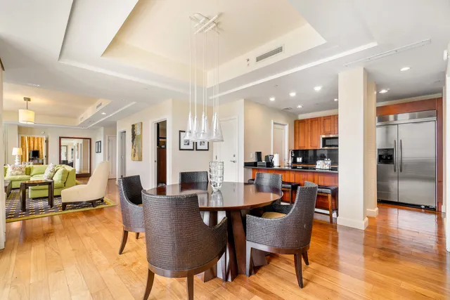 a view of a dining room with furniture and wooden floor