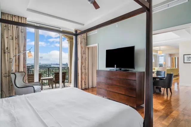 a bedroom with a bed and a flat screen tv