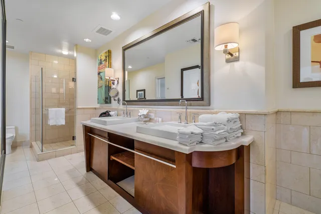 a bathroom with a sink double vanity and a mirror