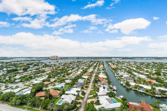 an aerial view of residential building and lake