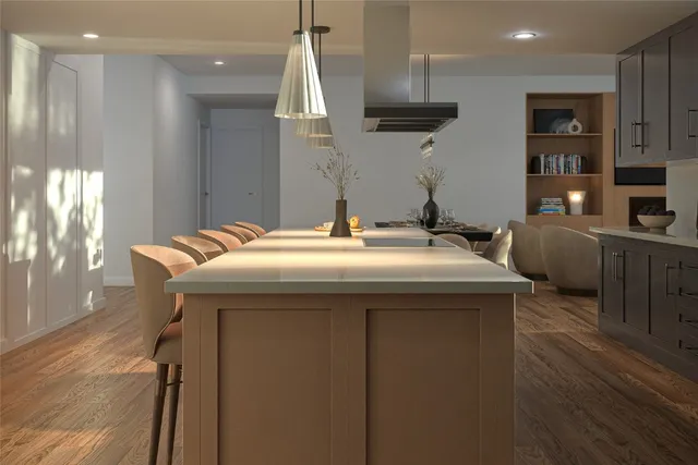 a kitchen with stainless steel appliances granite countertop a sink a stove and a refrigerator