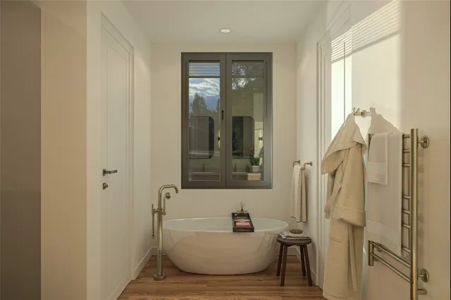 a bathroom with a tub and shower