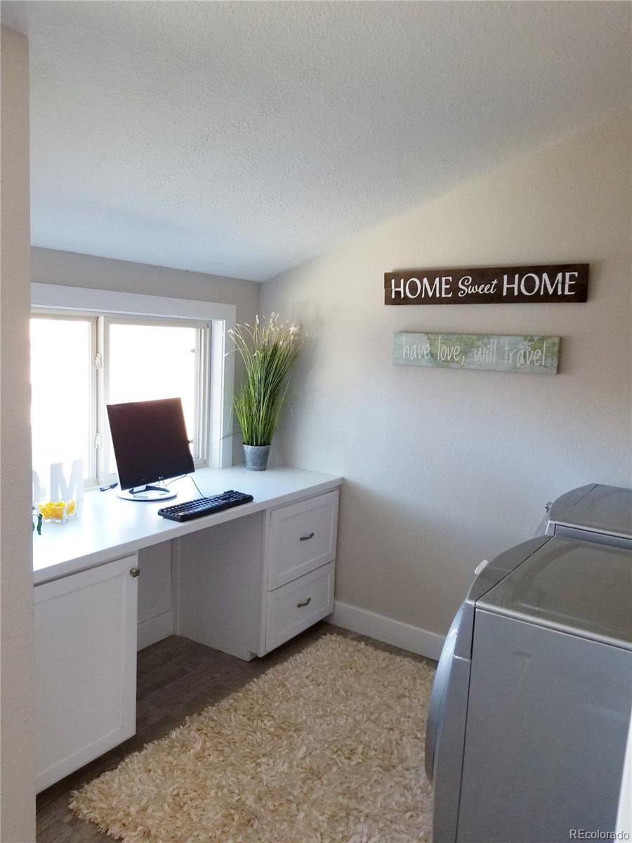 4307 Decatur Street Denver, CO 80211 - Photo 8 of 13 a room with a window and wooden floor