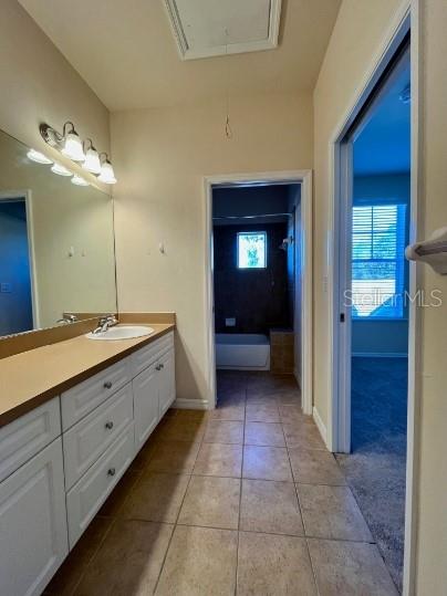 2646 Southwest 87 Way Gainesville, FL 32608 - Photo 11 of 19 a bathroom with a sink and a mirror