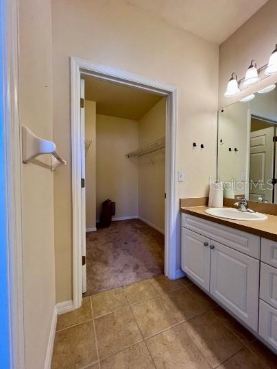 2646 Southwest 87 Way Gainesville, FL 32608 - Photo 12 of 19 a bathroom with a sink and a mirror
