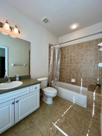 2646 Southwest 87 Way Gainesville, FL 32608 - Photo 14 of 19 a bathroom with a granite countertop sink toilet a mirror and a bathtub