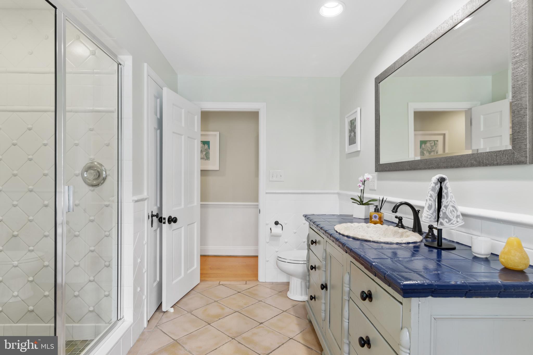 41 Crestline Road Wayne, PA 19087 - Photo 22 of 42 a bathroom with a granite countertop sink and a mirror