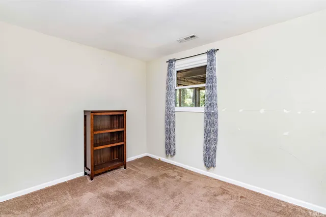 an empty room with closet and closet