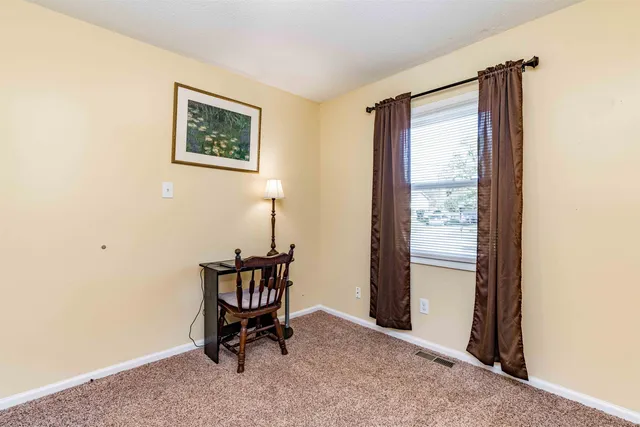 a view of front door with outdoor seating
