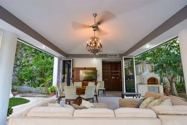 a view of a table and chairs in the garden