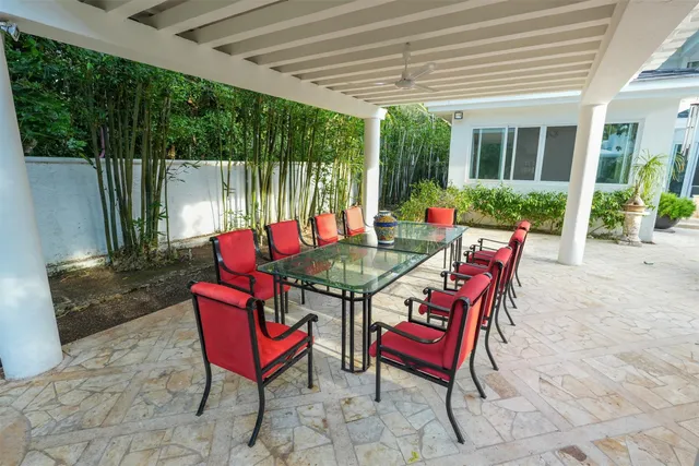 a spacious bedroom with a bed and a chandelier