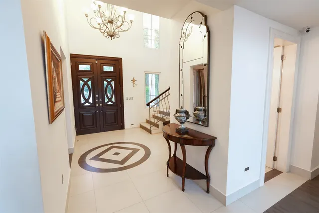 a bathroom with a sink a mirror and a shower