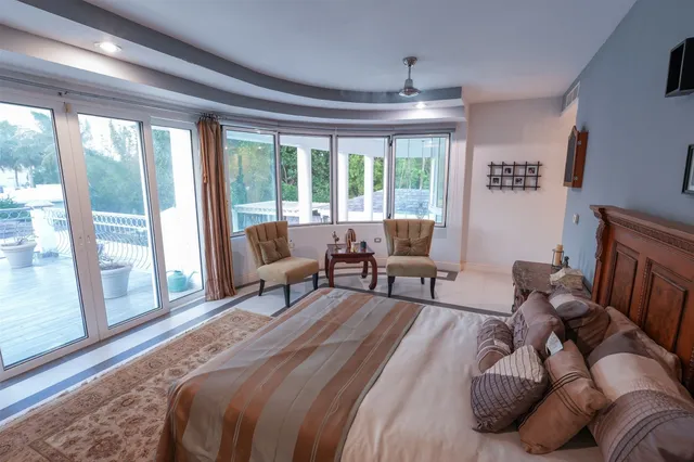 a view of a backyard with sitting area