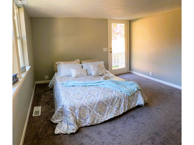 306 South Toutle Road Toutle, WA 98649 - Photo 23 of 36 a bedroom with a bed and a window