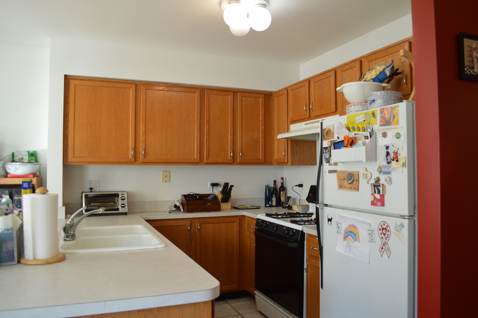 2214 Dawson Lane Algonquin, IL 60102 - Photo 2 of 14 a kitchen with refrigerator and cabinets