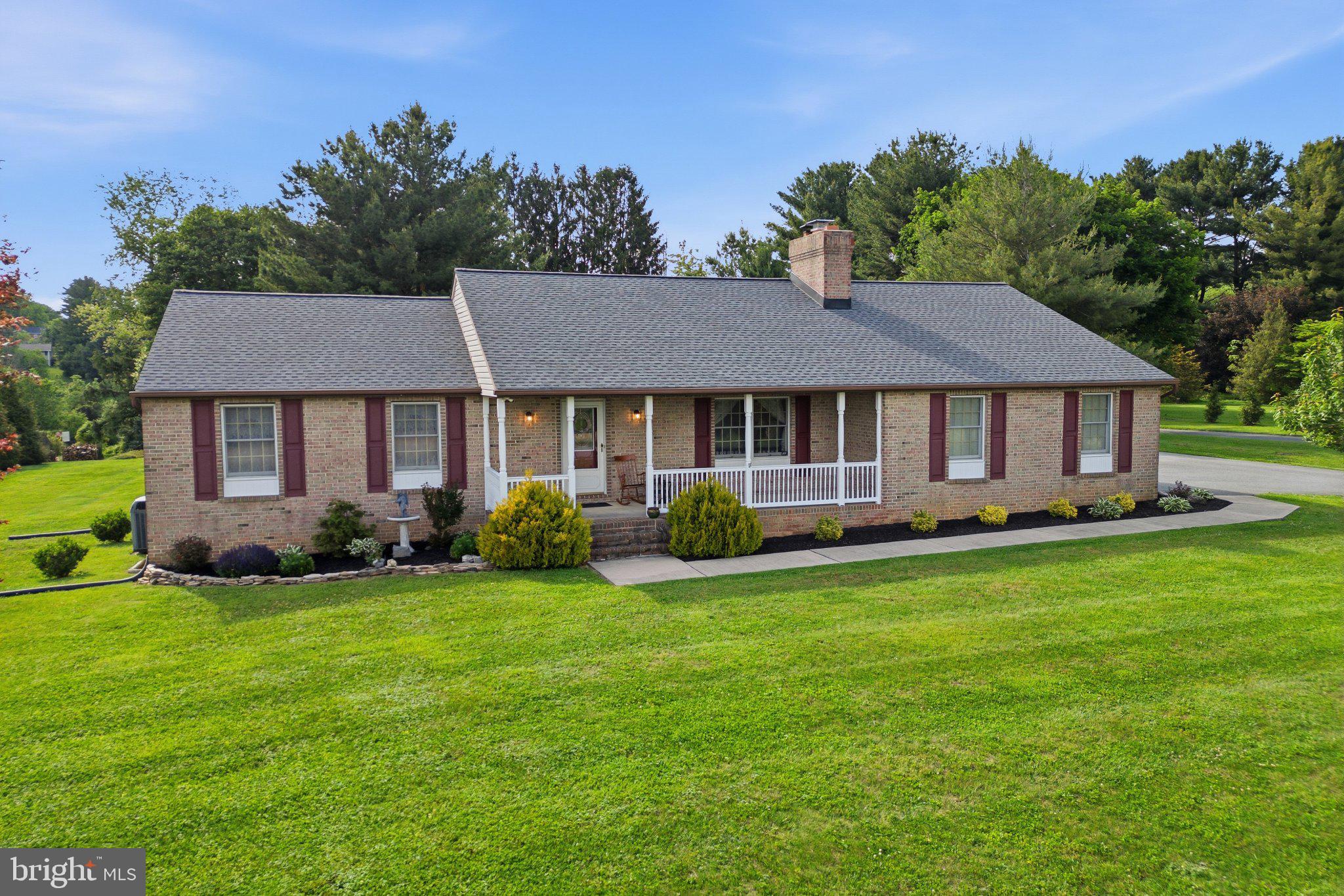 18310 Upper Beckleysville Road Hampstead, MD 21074 - Photo 2 of 67 Charming brick home on lush green lawn.