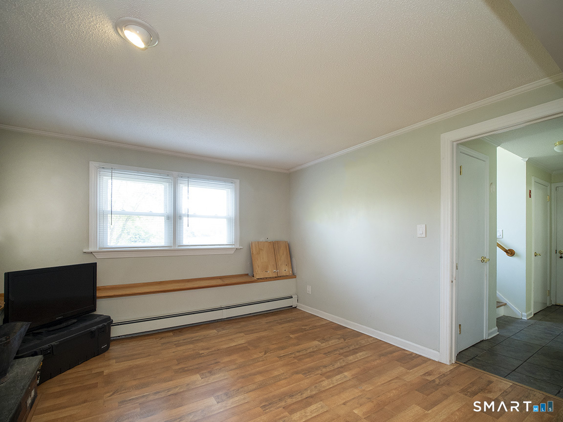82 Wilcox Road Middletown, CT 06457 - Photo 25 of 27 a view of room with window and a ceiling fan