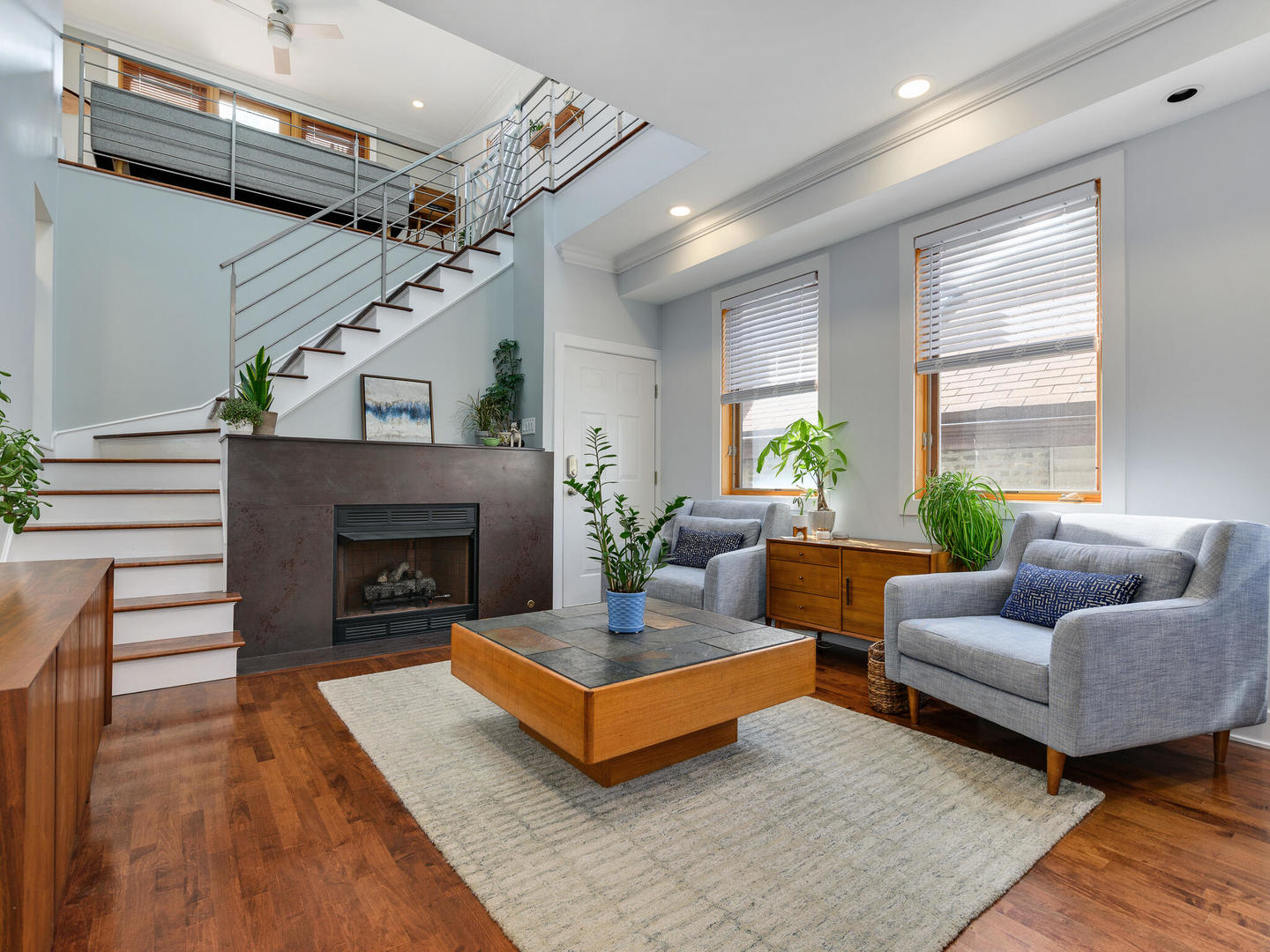 1834 West Rice Street, Unit C Chicago, IL 60622 - Photo 3 of 31 a living room with furniture and a fireplace