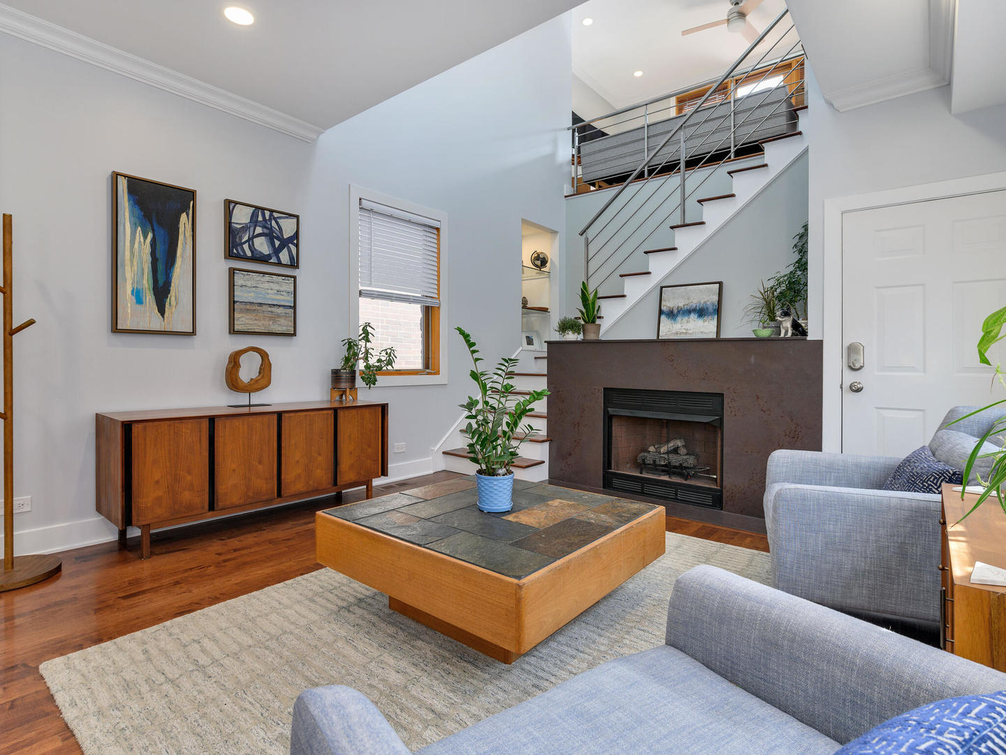 1834 West Rice Street, Unit C Chicago, IL 60622 - Photo 4 of 31 a living room with furniture and a fireplace